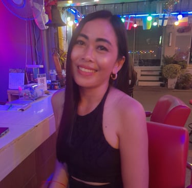 Thai woman sat in bar on Soi 80, Hua Hin in Thailand