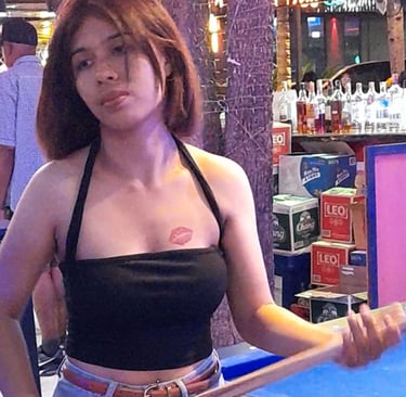 Thai woman playing pool at bar in Wonderland 2 in Hua Hin