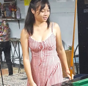 Thai woman playing pool at bar near Soi Bintabaht in Hua Hin