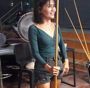 Thai woman playing pool at Station Bar, near Soi 94 in Hua Hin