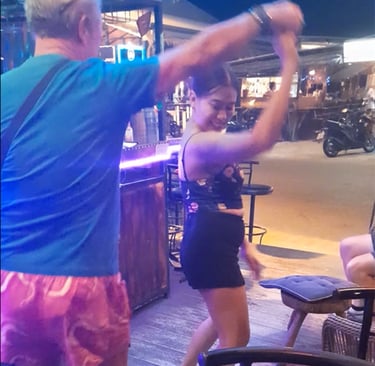 Man and Thai woman dancing at bar on Soi 94 in Hua Hin