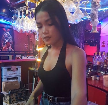Thai woman behind the bar at Wonderland in Hua Hin