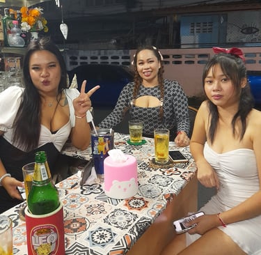 Thai women sat at bar at Nees Tiki Club on Petchkasem Road, Hua Hin