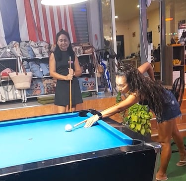 Thai women playing pool at bar near Soi 94 in Hua Hin