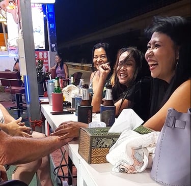 Thai women laughing at bar near Soi 94 in Hua Hin