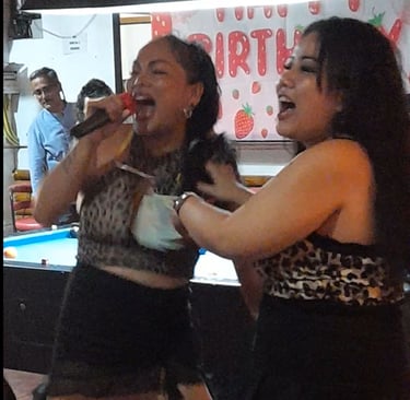 Thai women singing and dancing at bar on Soi 94, Hua Hin