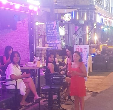 Thai women outside bar on soi Bintabaht, Hua Hin in Thailand