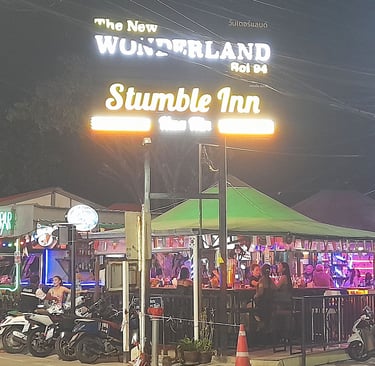 Street view of Wonderland bar complex and sign in Hua Hin