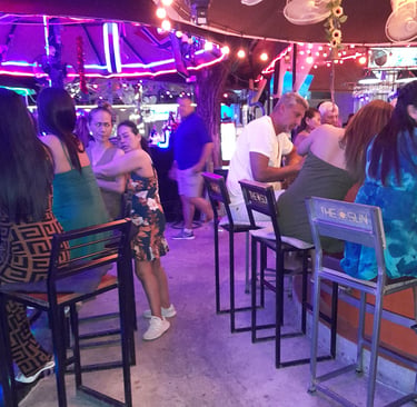 Thai women sat at bars in Wonderland bar complex, Hua Hin
