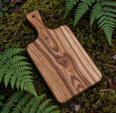 A rustic wooden cutting board nestled among moss and ferns, bathed in soft forest light.