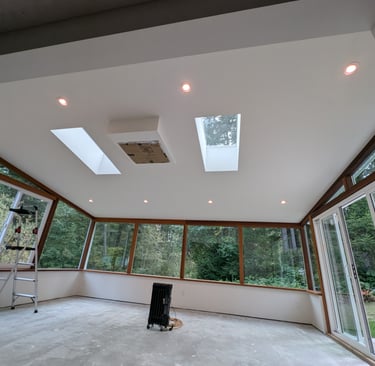 Residential sunroom addition with recessed LED ceiling lights and skylights Victoria BC