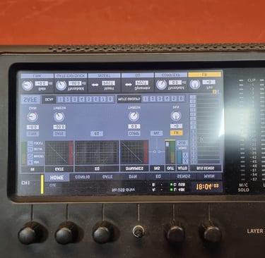 Digital audio mixing console screen showing sound levels, channel settings, and professional recording controls.