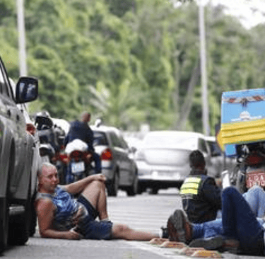 People protecting theirselves from shooting in Rio de Janeiro
