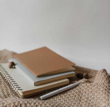a notebook with a notebook and pen and a notebook