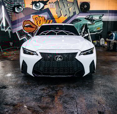 Lexus IS 350 getting Maxxis tyres installed at a professional tire shop in Lagos