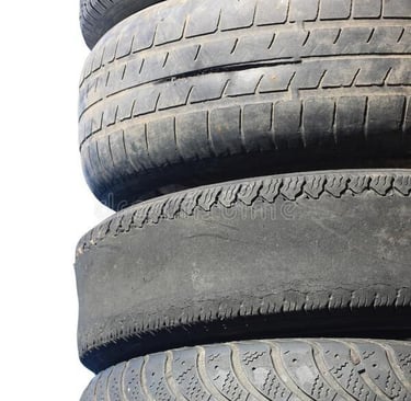 Worn out car tyres in a tire repair shop Nigeria
