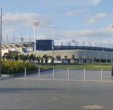 A wide-angle view of the Melbourne Cricket Ground (MCG) and the adjacent Kia Arena in Melbourne, Australia.