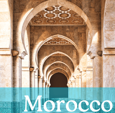 A row of columns with a brown and white tiled ceiling with the word Morocco written in white
