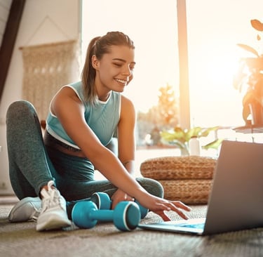 a woman sitting having a virtual physio session with the london physio