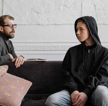 Photo by cottonbro studio: https://www.pexels.com/photo/man-in-black-hoodie-sitting-on-brown-wooden-