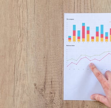 Photo by Lukas: https://www.pexels.com/photo/person-pointing-paper-line-graph-590041/