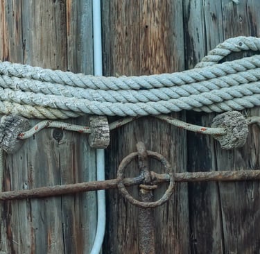 Photo by Kindel Media: https://www.pexels.com/photo/close-up-of-an-anchor-rope-on-a-wooden-block-835