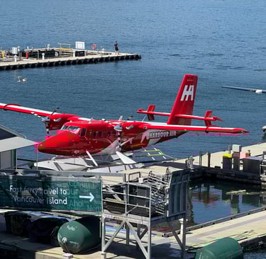 Photo by The Six: https://www.pexels.com/photo/red-seaplane-docked-at-vancouver-harbor-34875613/