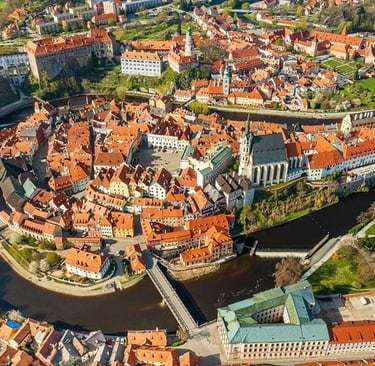 Aerial view of Cesky Krumlov historic town center and Vltava River in Czech Republic.