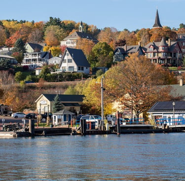 Scenic view of Bayfield, Wisconsin shoreline with autumn fall foliage and Madeline Island Ferry dock.