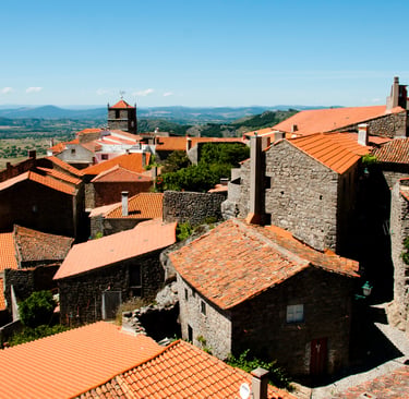 Panoramic view of Monsanto Portugal featuring historic stone houses with orange tiled roofs.