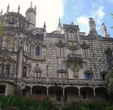 The ornate Neo-Manueline architecture of the Quinta da Regaleira palace in Sintra, Portugal.