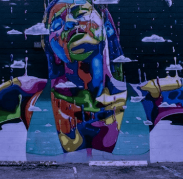 a colorful mural of a woman's face in downtown St. Petersburg FL