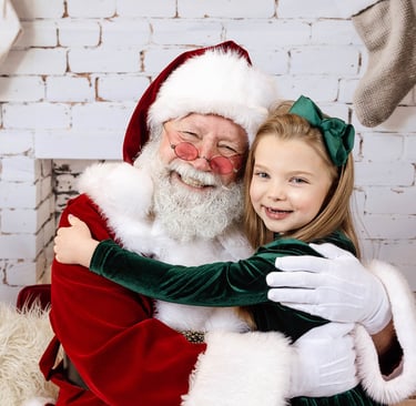 Sabta Jay giving a girl a hug.