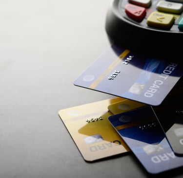 credit cards next to a payment reader