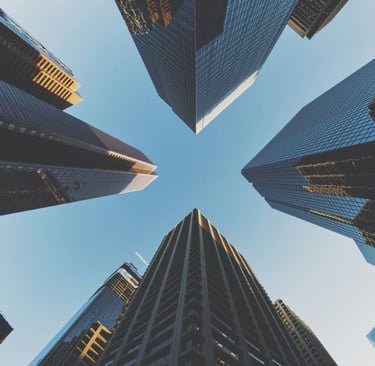 Upward view of tall modern office buildings in an international business district