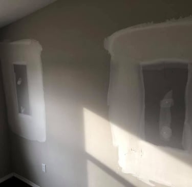 The windows were removed and drywall has been repaired filling in the hole