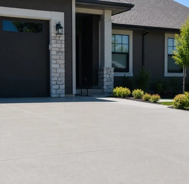New residential concrete driveway with a smooth professional finish outside a modern home in Eagle Mountain
