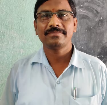 a man in a blue shirt and glasses