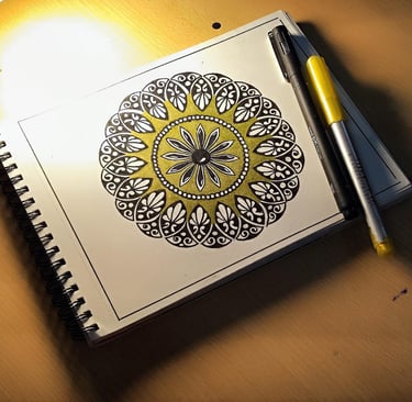 a notebook with a pen and a pen on a table