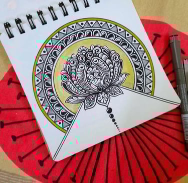 a notebook with a pen and a pen on it