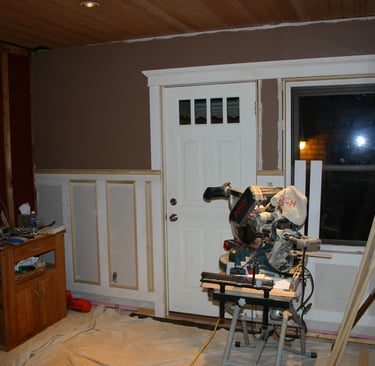 New drywall, custom trim and wainscotting along with a fresh coat of paint.