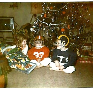 Christmas morning perhaps 1975 or '76, Karen, Derek and me. Derek in SF 49ers gear and me LA Rams