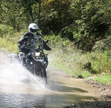 2015 on the Trans Wisconsin ride fording a bit of water and mud on my BMW F800 GS