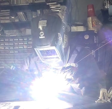 Welding a miter joint in my garage. Building the frame for my bar..