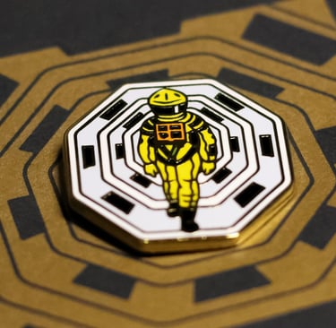 a yellow and black badge with a yellow and white astronaut suit