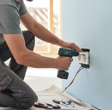 Electrician in Coventry installing a socket 