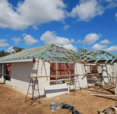 Qualified Perth building inspector evaluating new construction site for structural compliance and workmanship quality.