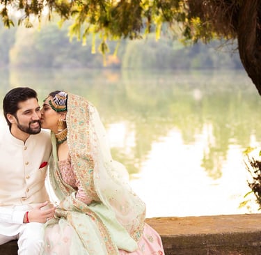 a man and woman in traditional indian wedding attire