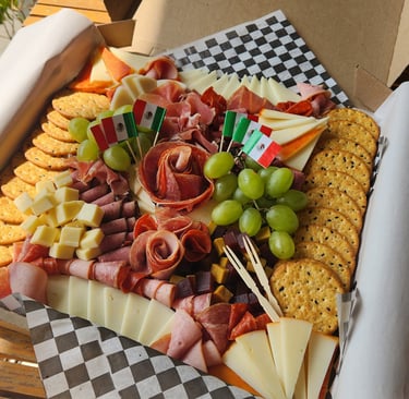 a box of cheese, meat and crackers in a box