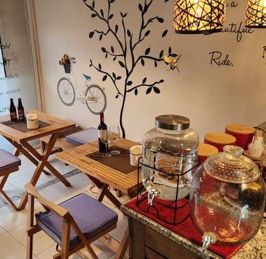 a table with a wine bottle and a glass of wine